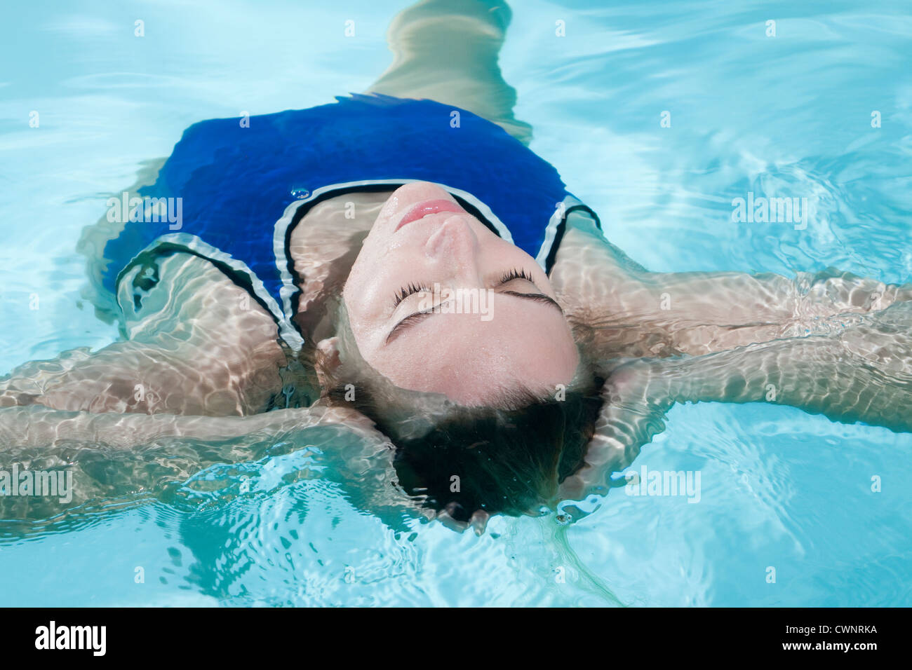 young woman in swimming pool Stock Photo