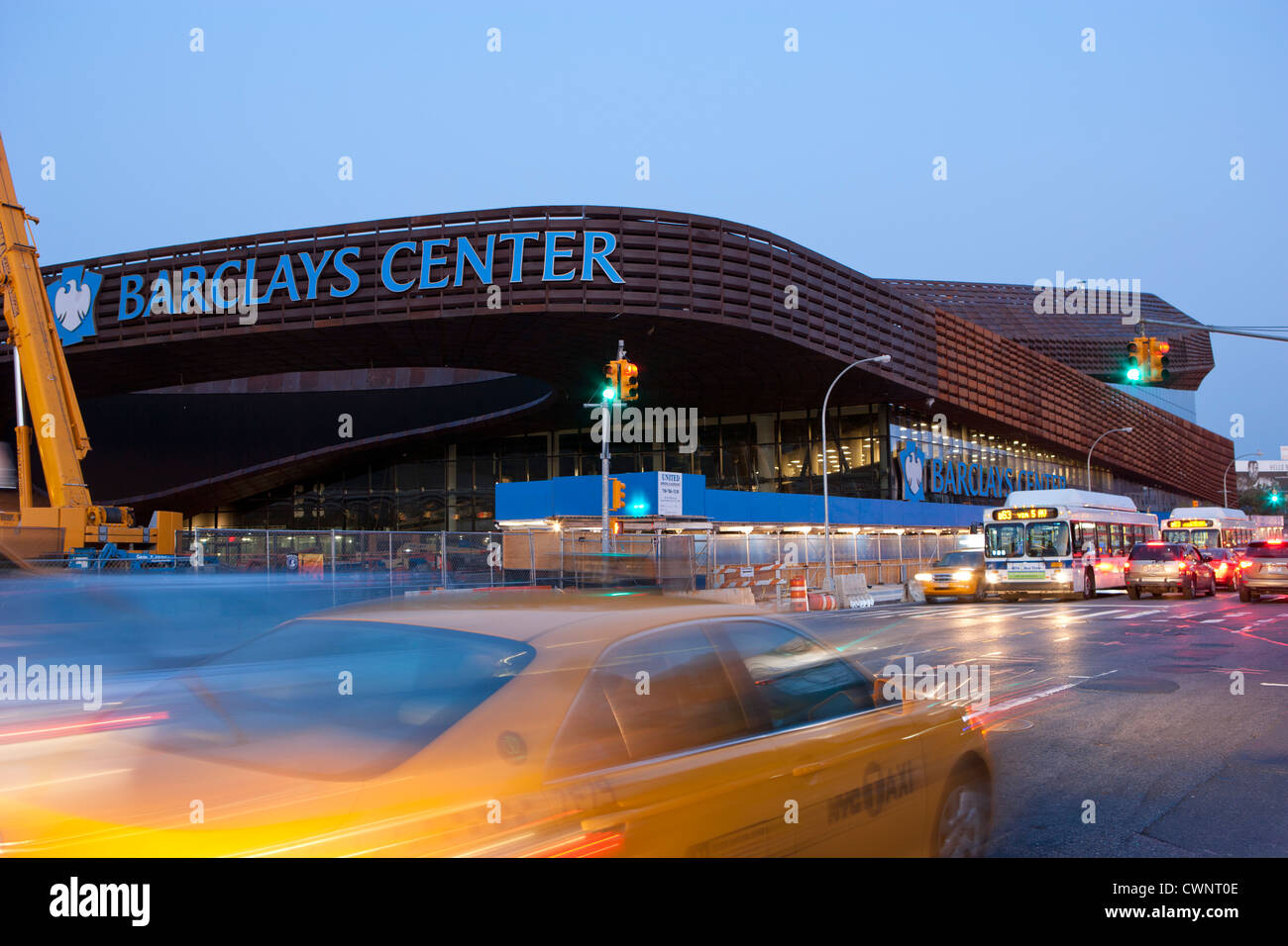 Traffic rushes pass the new Barclays Center home of the Brooklyn Nets Sports Arena and Concert Hall, Brooklyn, NY, USA Stock Photo