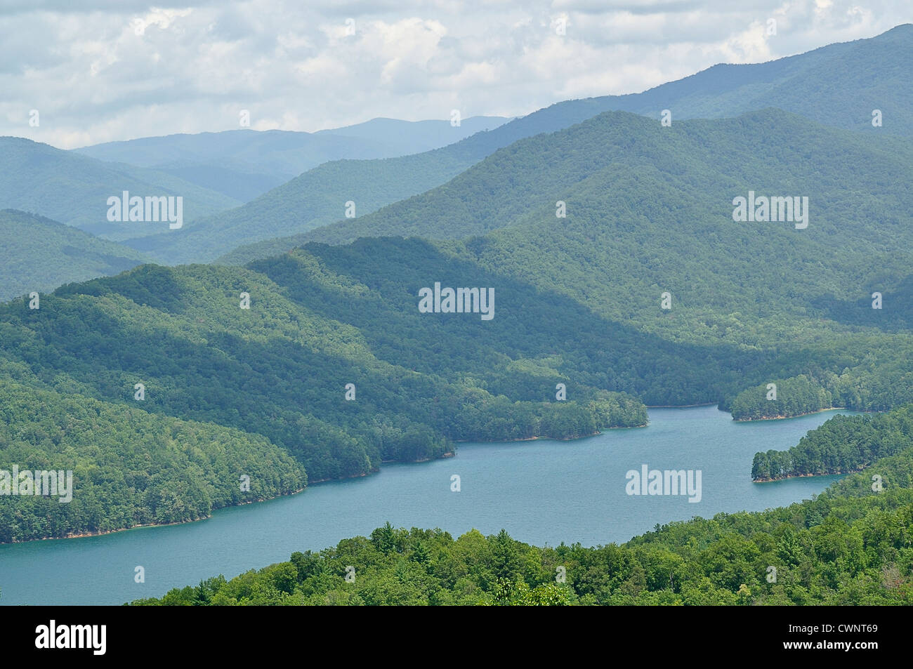 Blue haze across the mountains of its name sake with Fontana lake in the foreground. Stock Photo