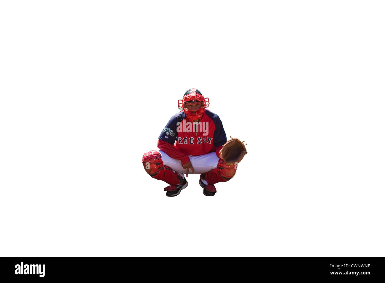 Cut Out. Boston Red Sox Catcher with Catcher's Mitt showing a "deuce" or a two finger sign between his legs on white background. Stock Photo
