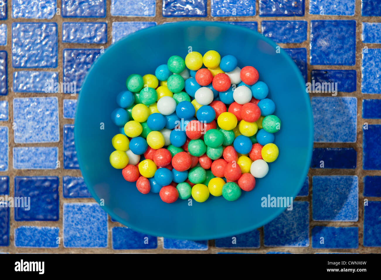 Colorful candies in bowl Stock Photo