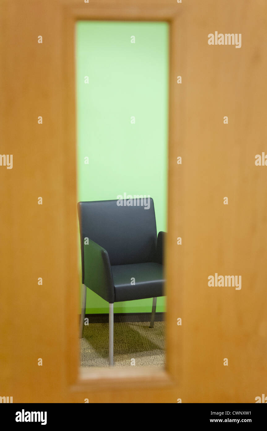 Armchair viewed through door window Stock Photo Alamy