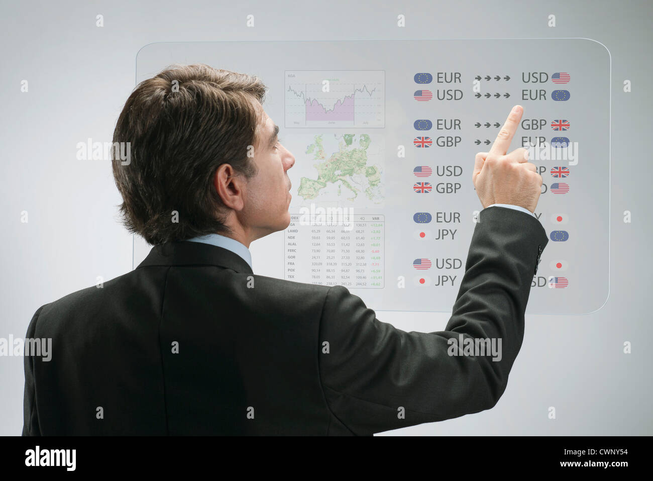 Businessman using advanced touch screen technology to view business data Stock Photo