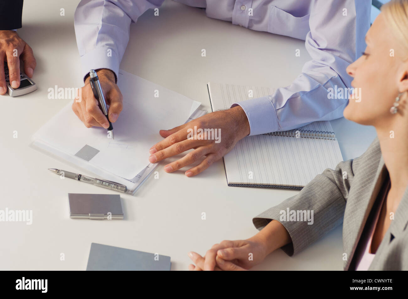 Business associates brainstorming together, cropped Stock Photo