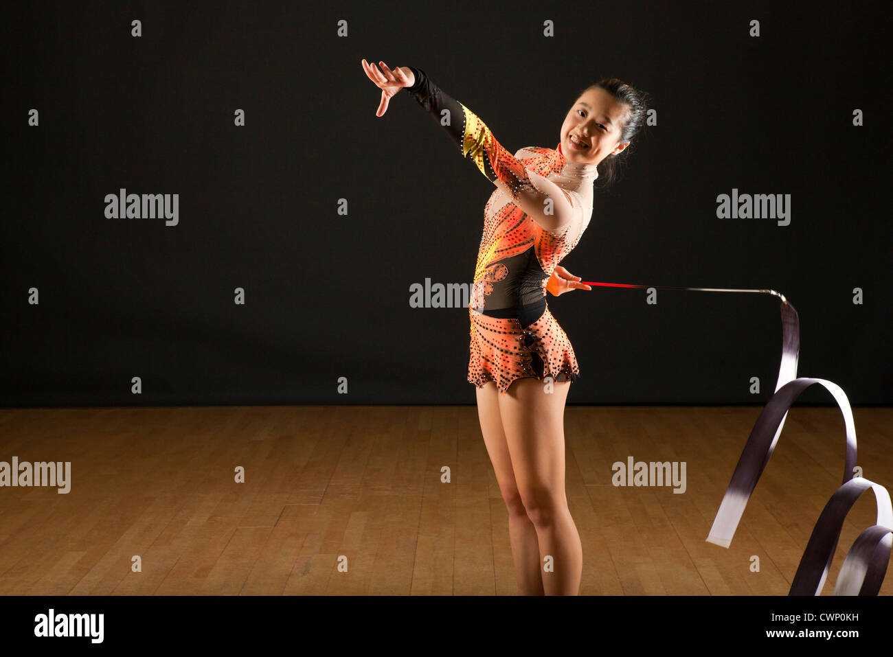 Gymnast twirling ribbon Stock Photo