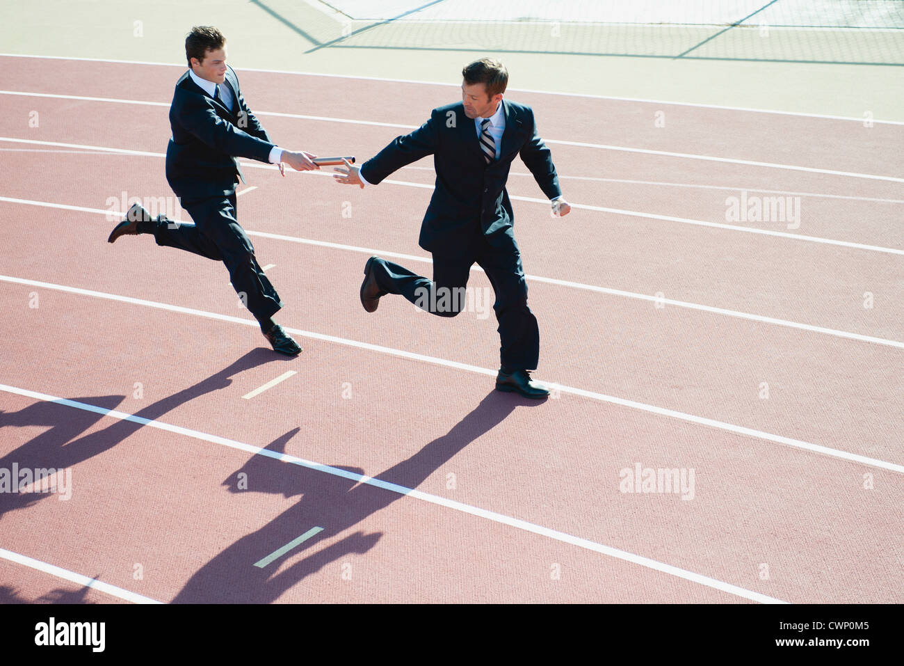 Businessmen Running Relay Race Stock Photo Alamy