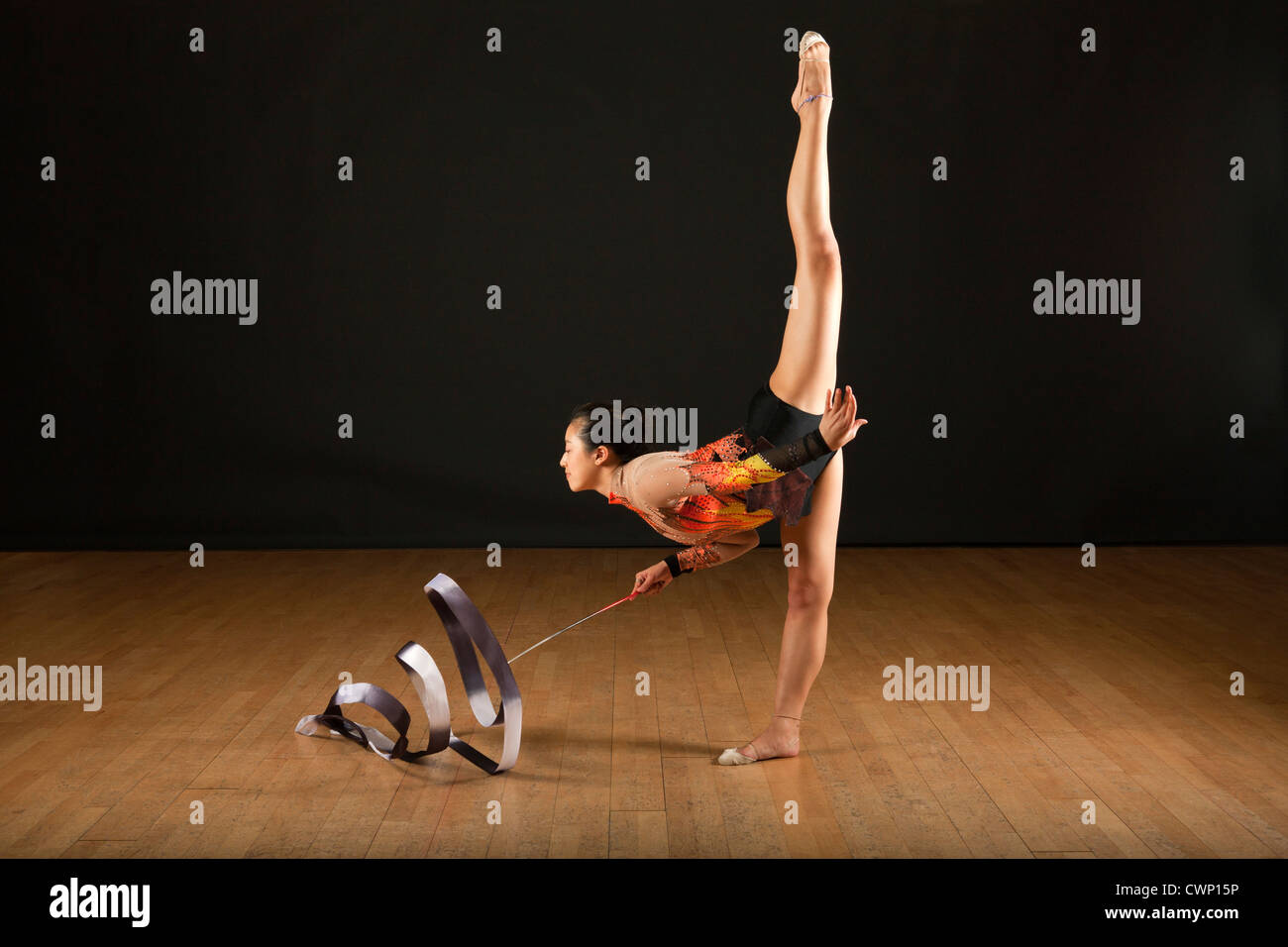 Gymnast performing standing splits Stock Photo