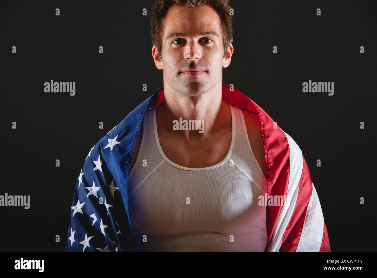 Athlete covered with American flag, portrait Stock Photo