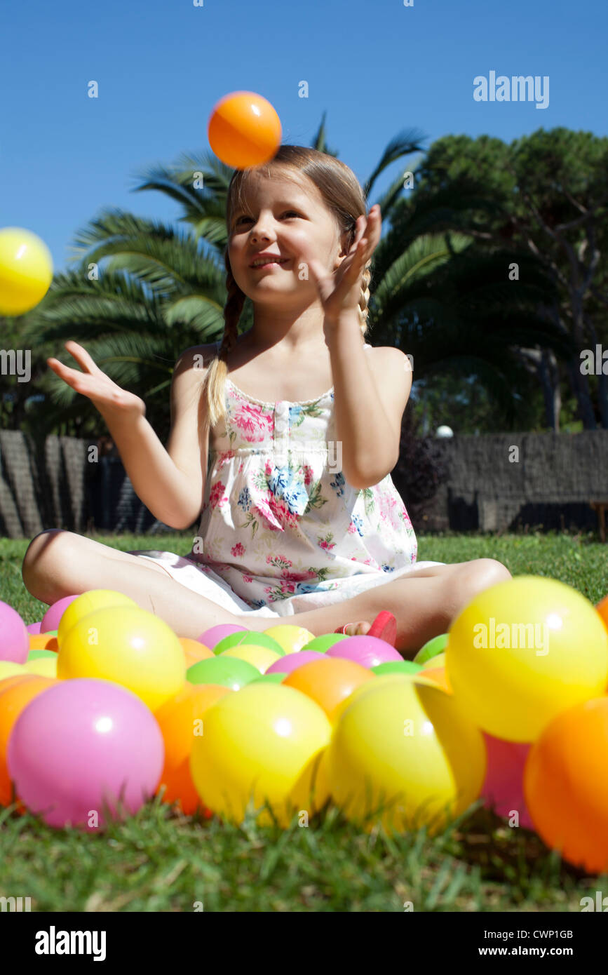 Girl playing with plastic balls Stock Photo Alamy