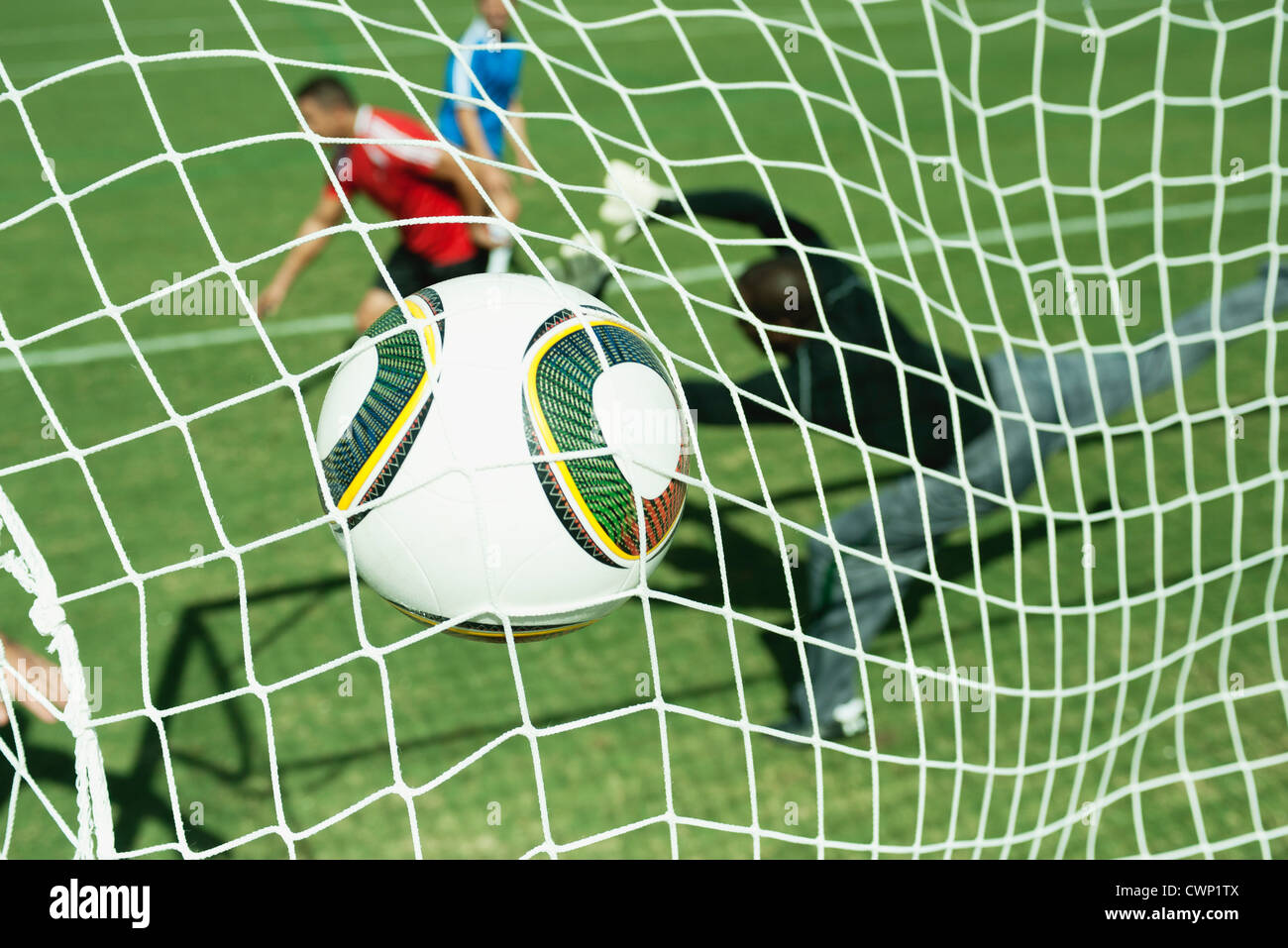 Soccer ball hitting goal net Stock Photo Alamy