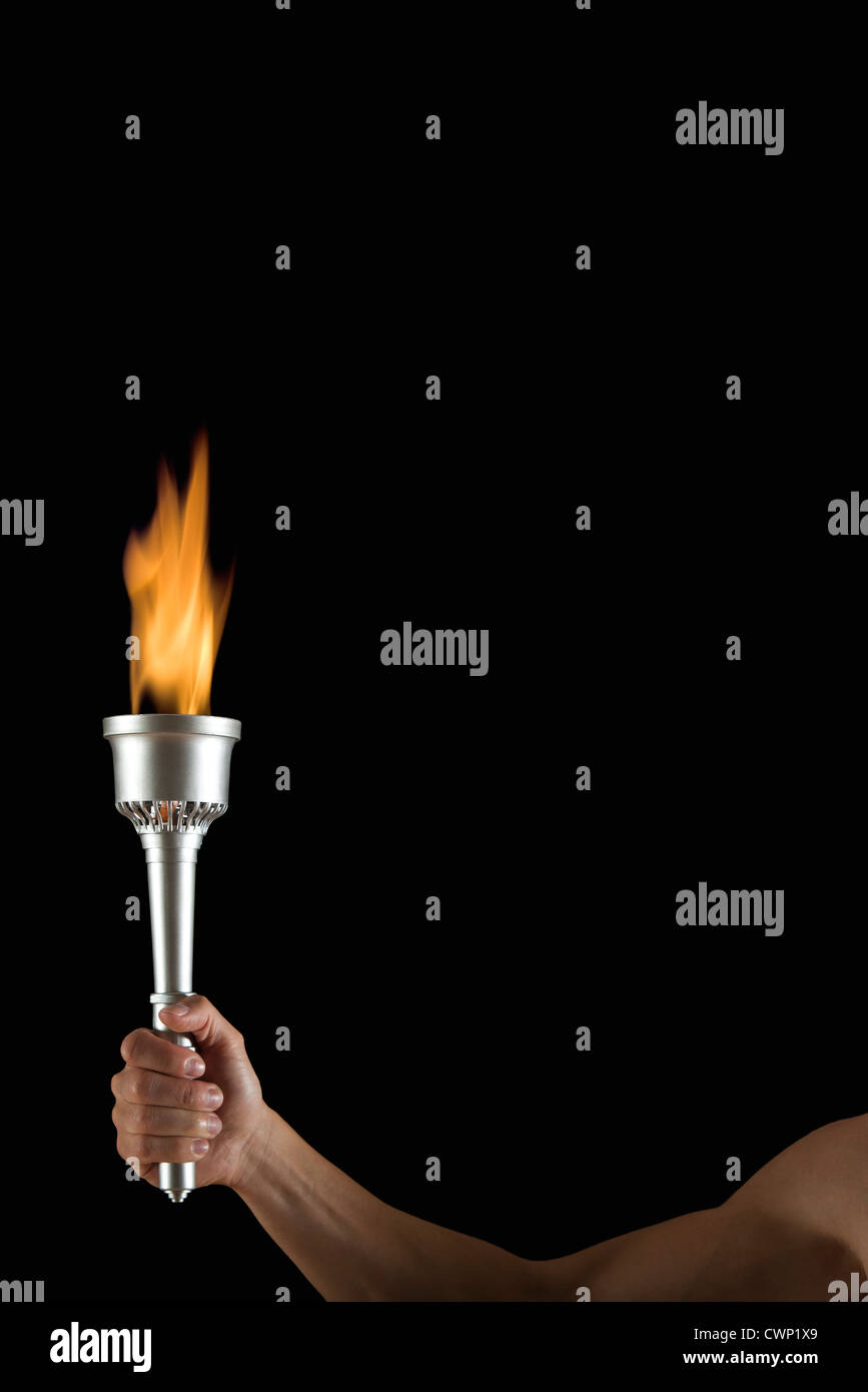 Man holding torch in dark hires stock photography and images Alamy