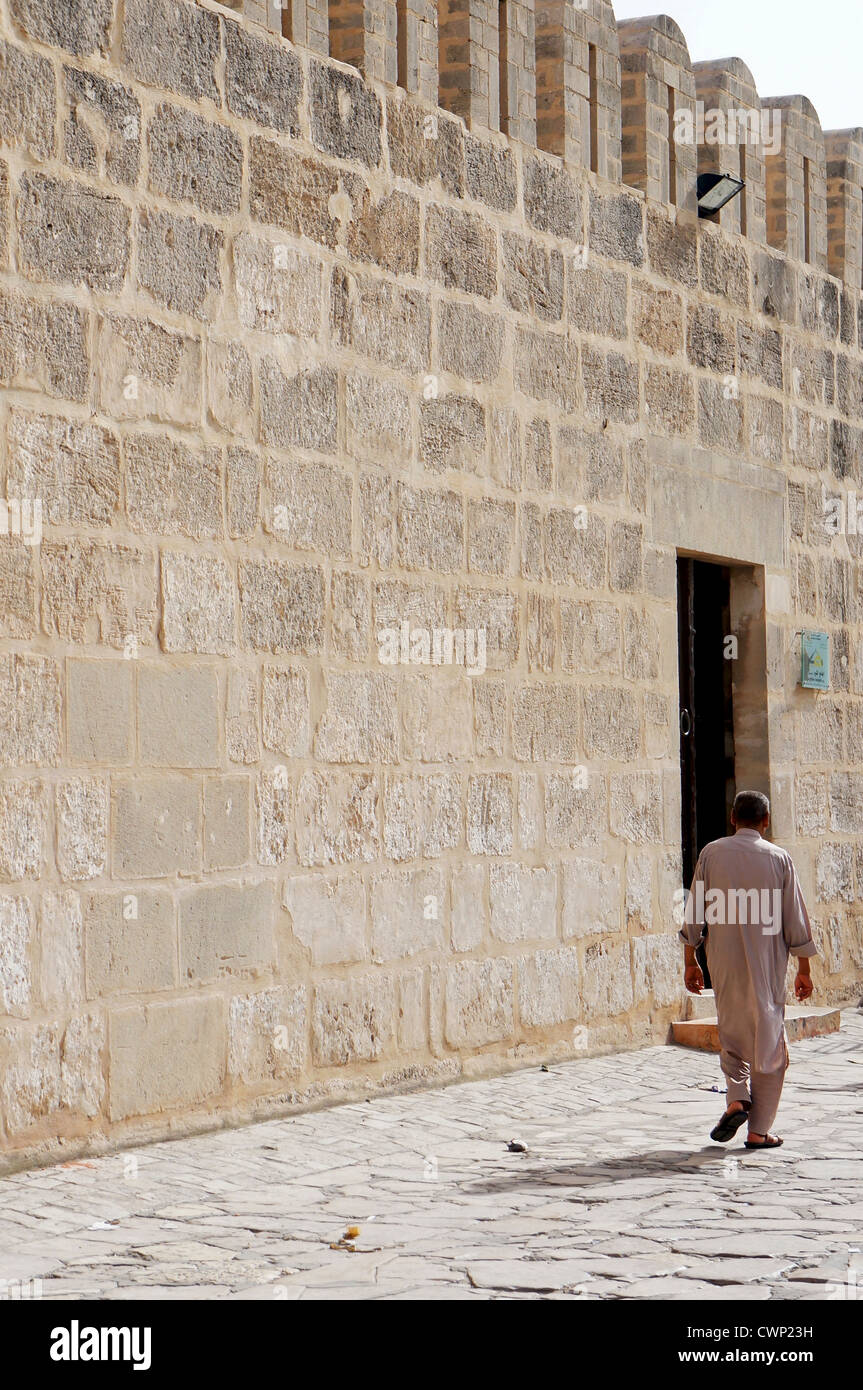 A Tunisian Man Walking To The Great Mosque Of Sousse In The Medina Of