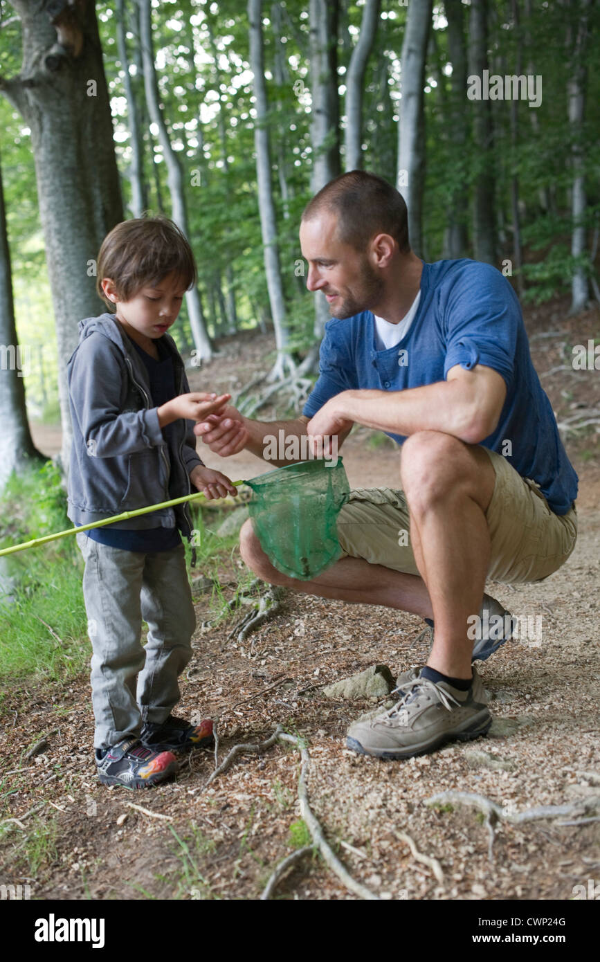 Father and son in woods Stock Photo