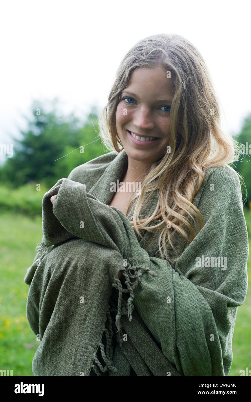Young woman wrapped in blanket, portrait Stock Photo Alamy