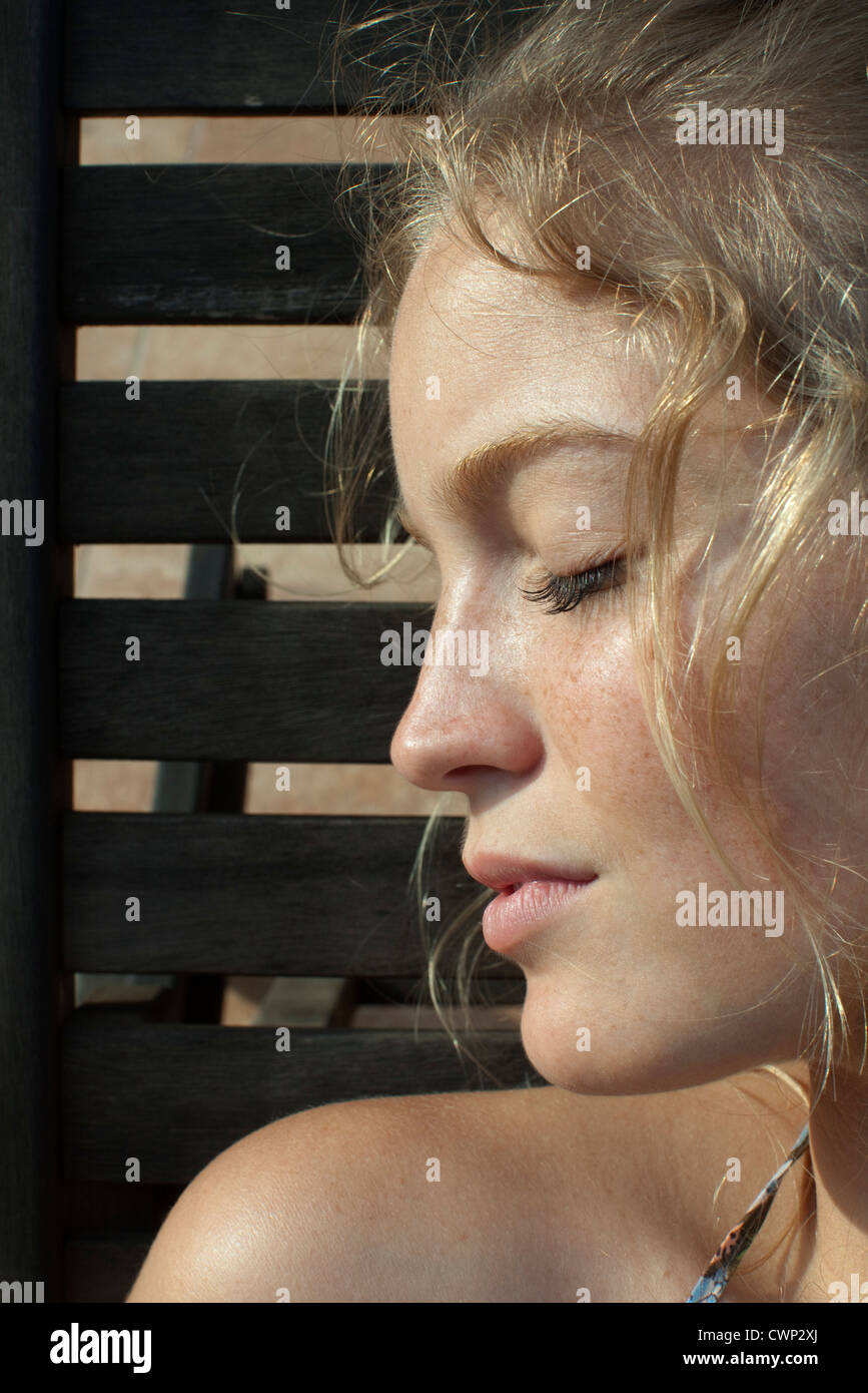 Young woman in profile, eyes closed, portrait Stock Photo