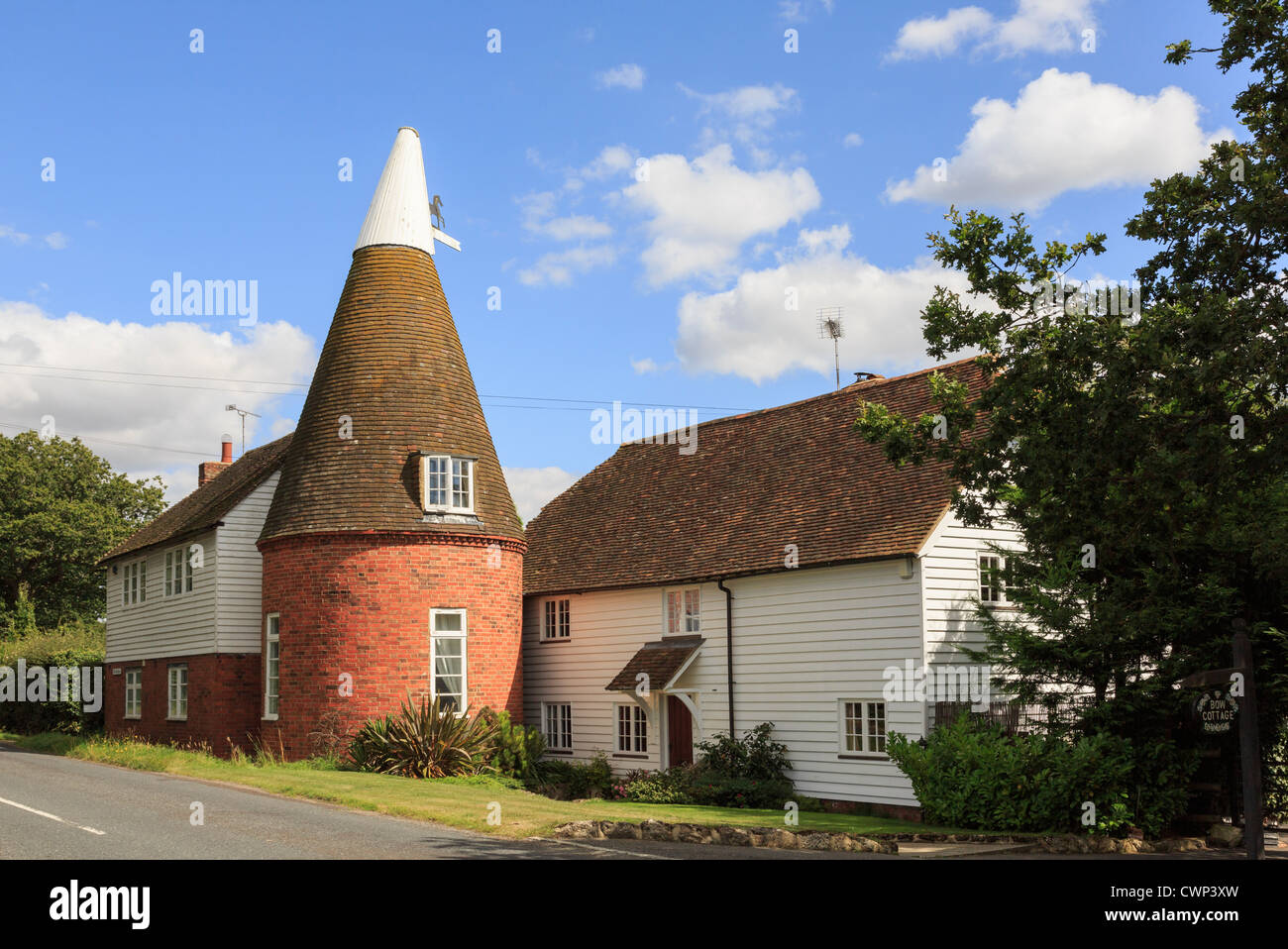 Old traditional Oast house with typical Kentish white wooden clapboard
