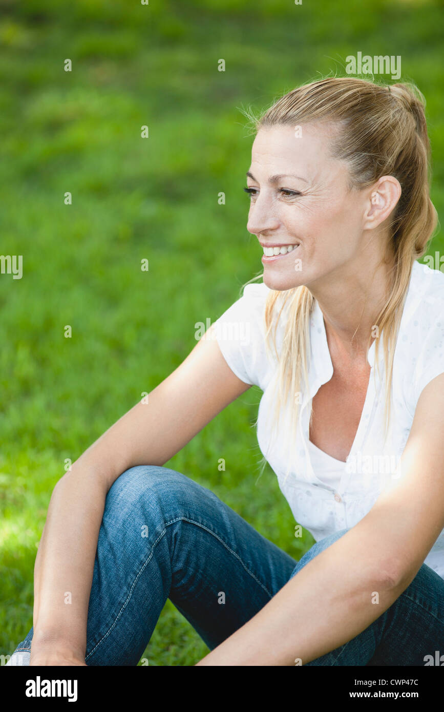 Mature woman relaxing outdoors Stock Photo
