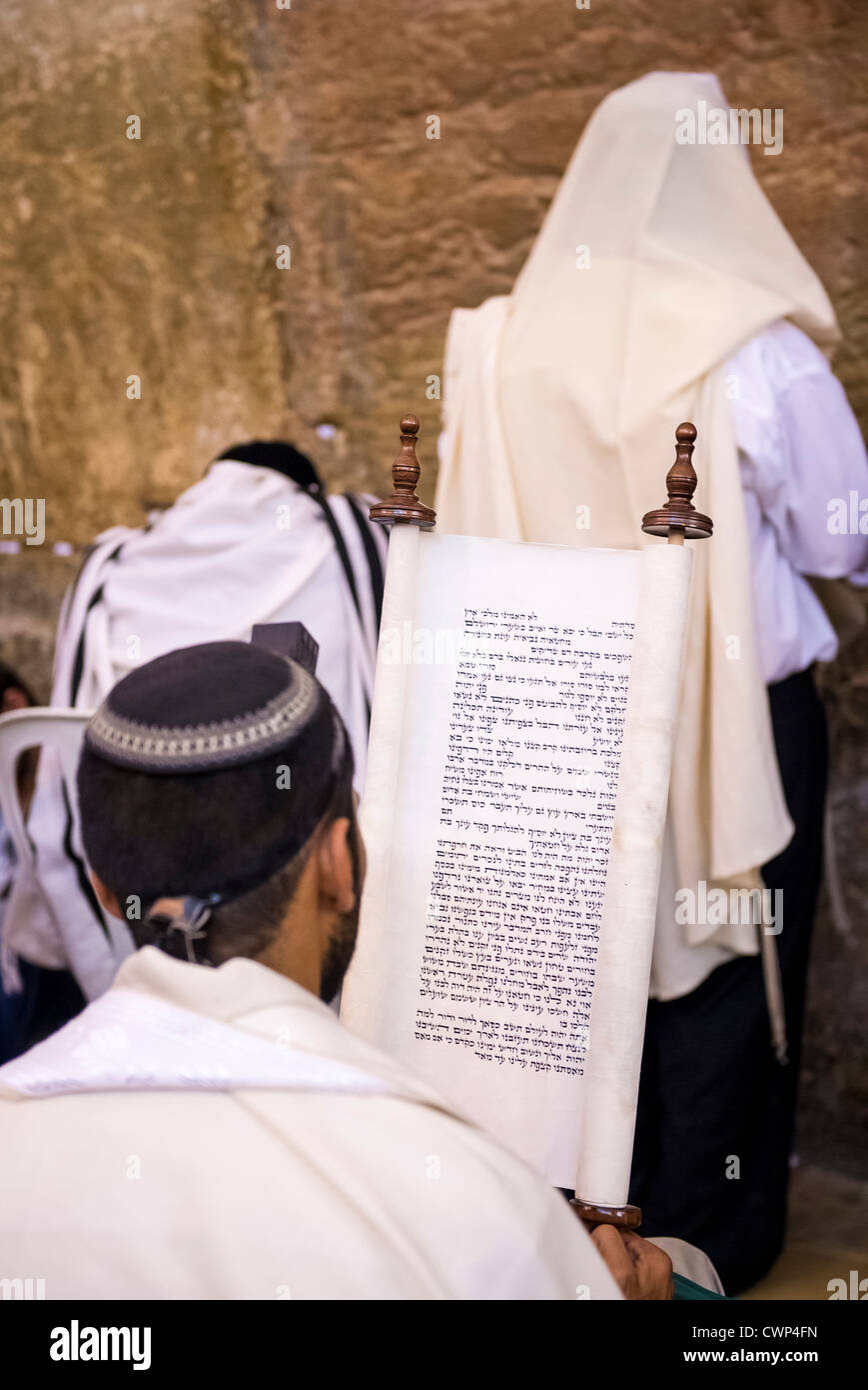 Jewish man prays in the Wailing wall during the Jewish holiday of Tisha B'av Stock Photo