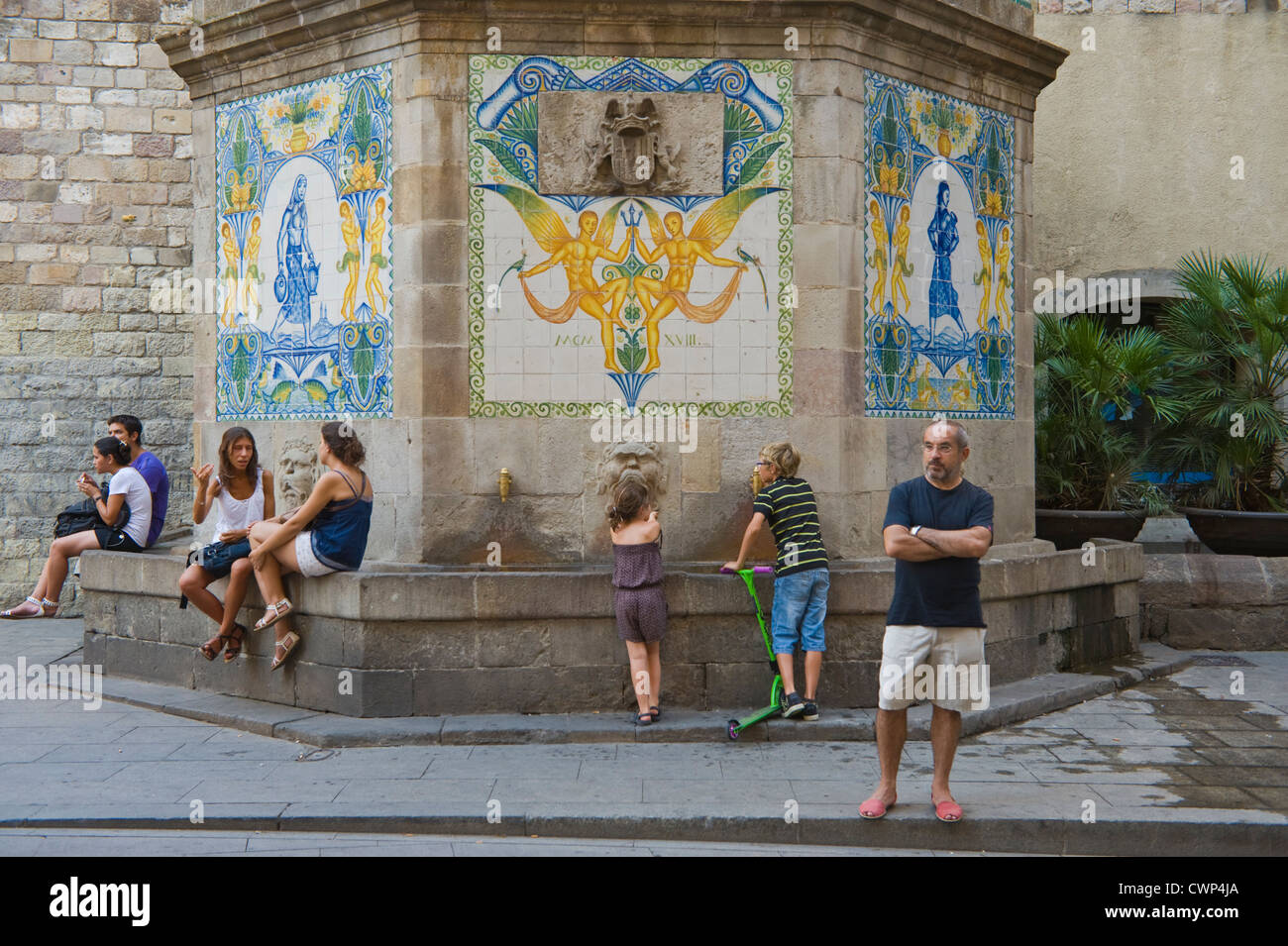 Barcelona people at large ornate tiled public water drinking fountain