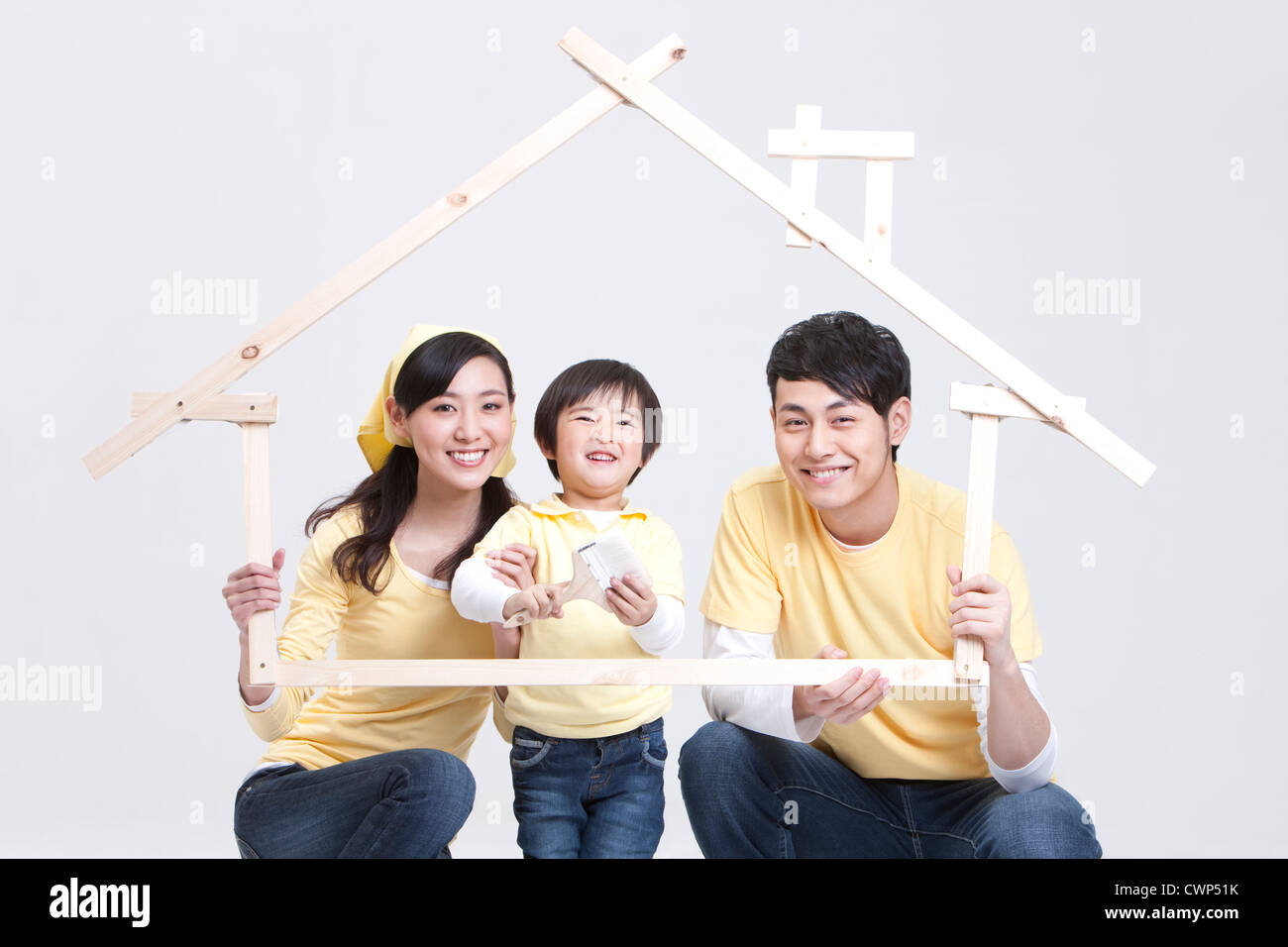Happy family doing DIY home improvement Stock Photo
