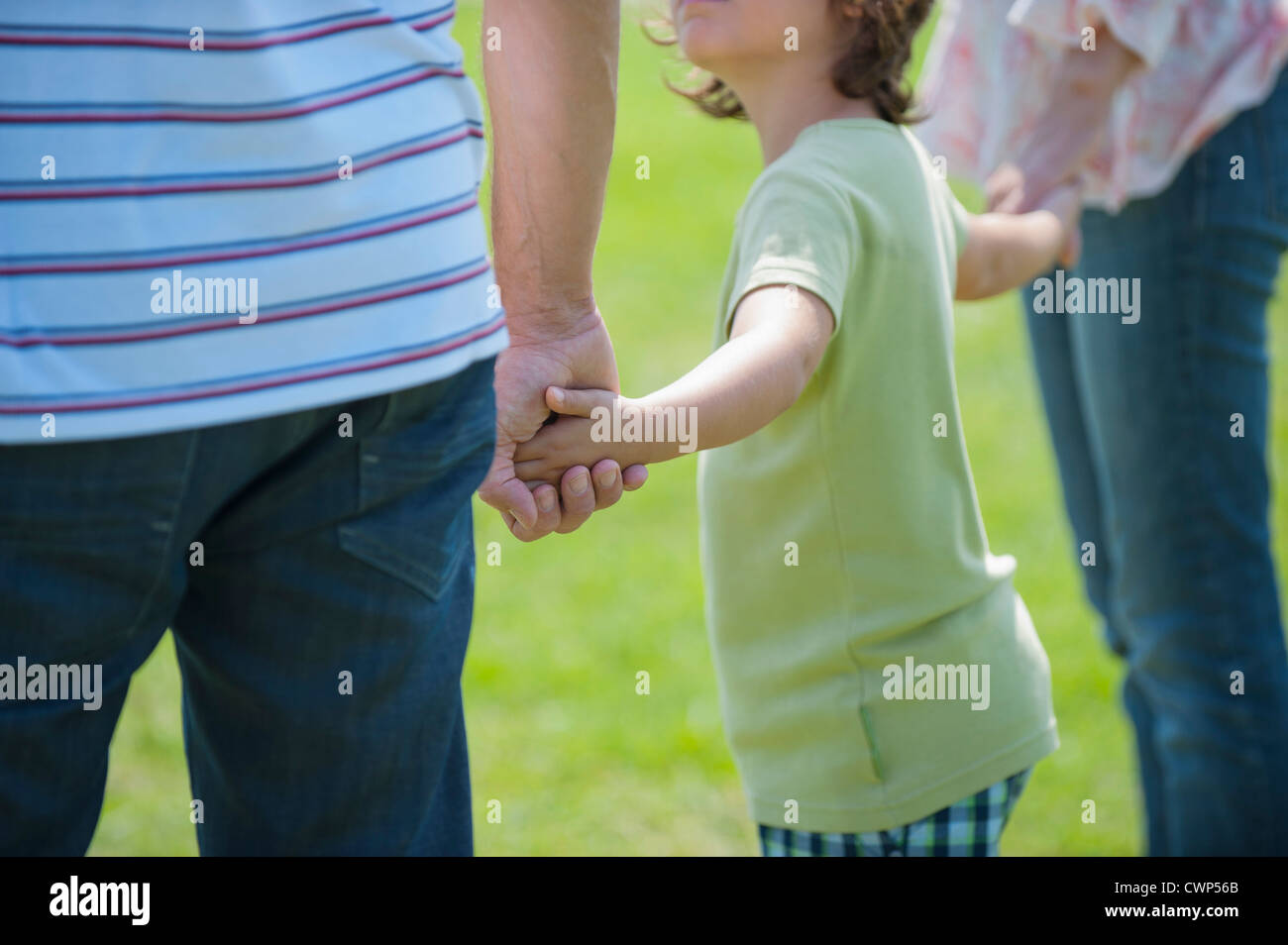 Two boys holding hands back view hi-res stock photography and images ...