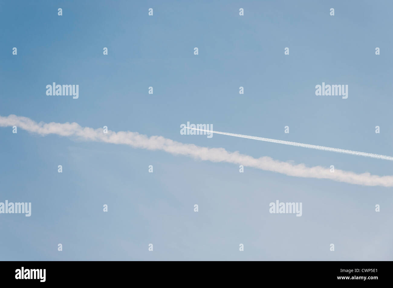 Vapor trails in sky Stock Photo - Alamy