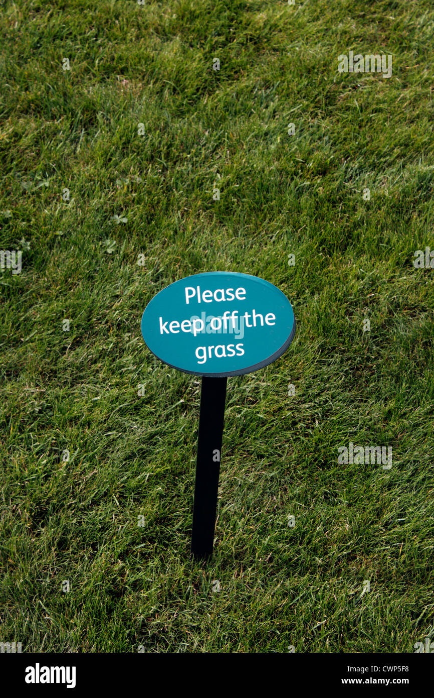 KEEP OFF OF THE GRASS SIGN. Stock Photo