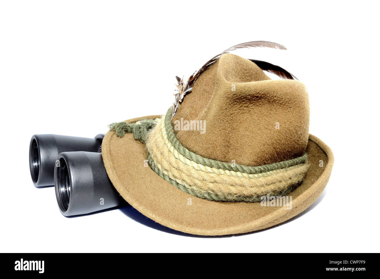 hunting gear - binoculars covered by hat over white Stock Photo