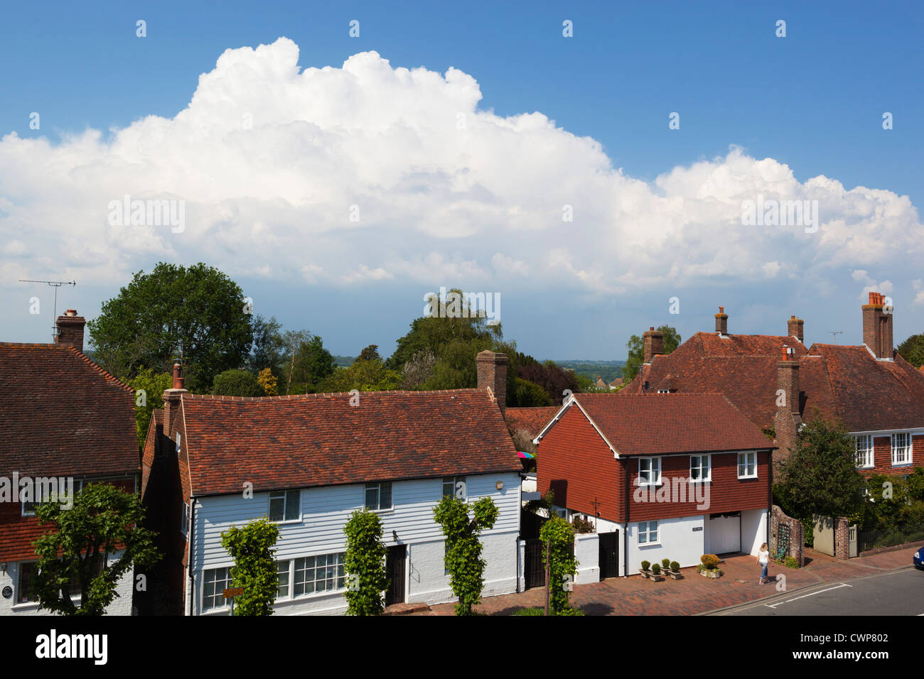 Approaching thunder clouds over Burwash village Stock Photo