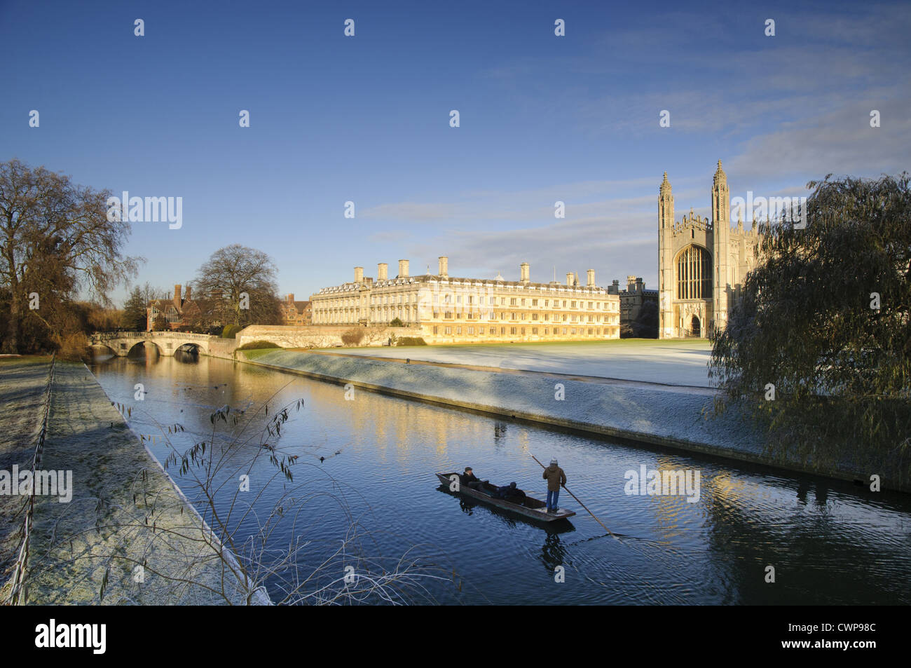View of river with punt approaching bridge and college buildings in frost, Clare Bridge, Jerwood Library, Trinity Hall, Clare Stock Photo