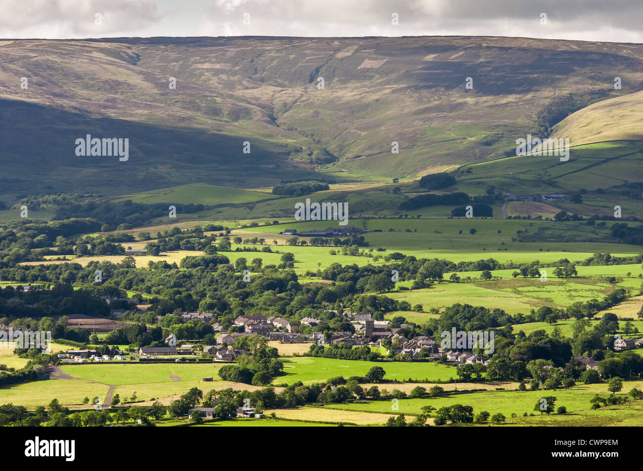 View of village, farmland and upland habitat, Chipping, Forest of Bowland, Lancashire, England, july Stock Photo