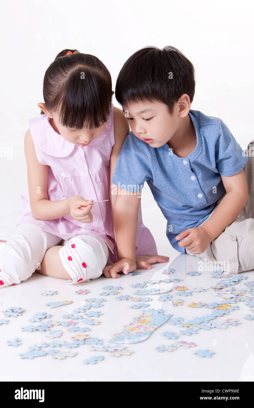 Girl playing jigsaw puzzles Stock Photo Alamy