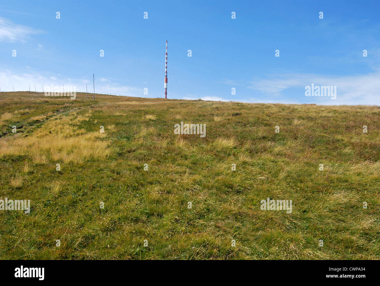 Kralova hola hill in easternmost part of Nizke Tatry mountains in Slovakia with mountain meadow and communication tower Stock Photo