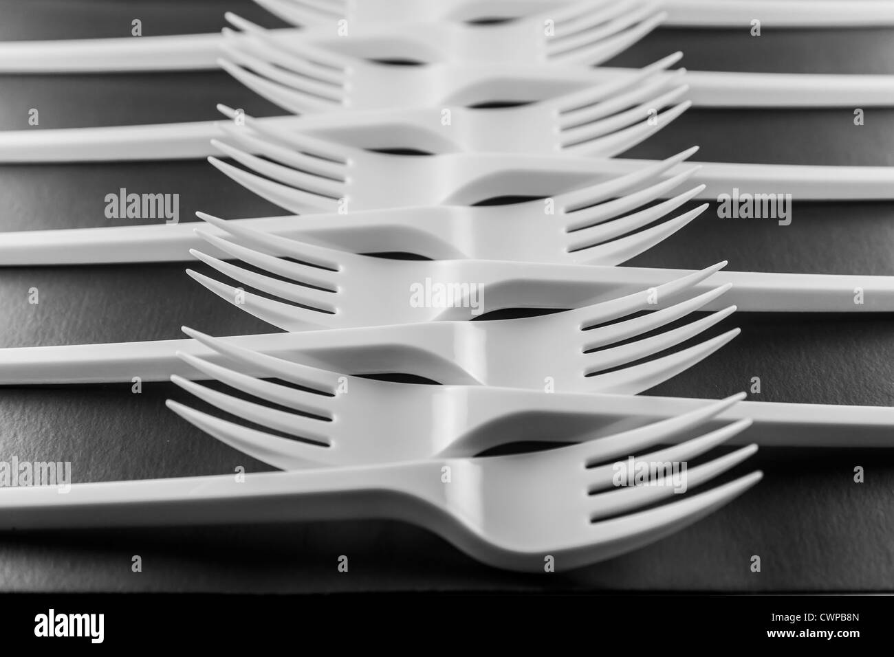 Photo of plastic forks on a black background Stock Photo Alamy