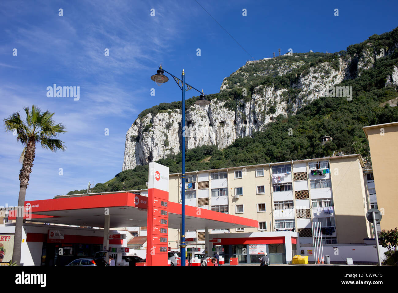 Gibraltar Rock urban scenery, Gib Oil petrol station and apartment buildings residential architecture. Stock Photo