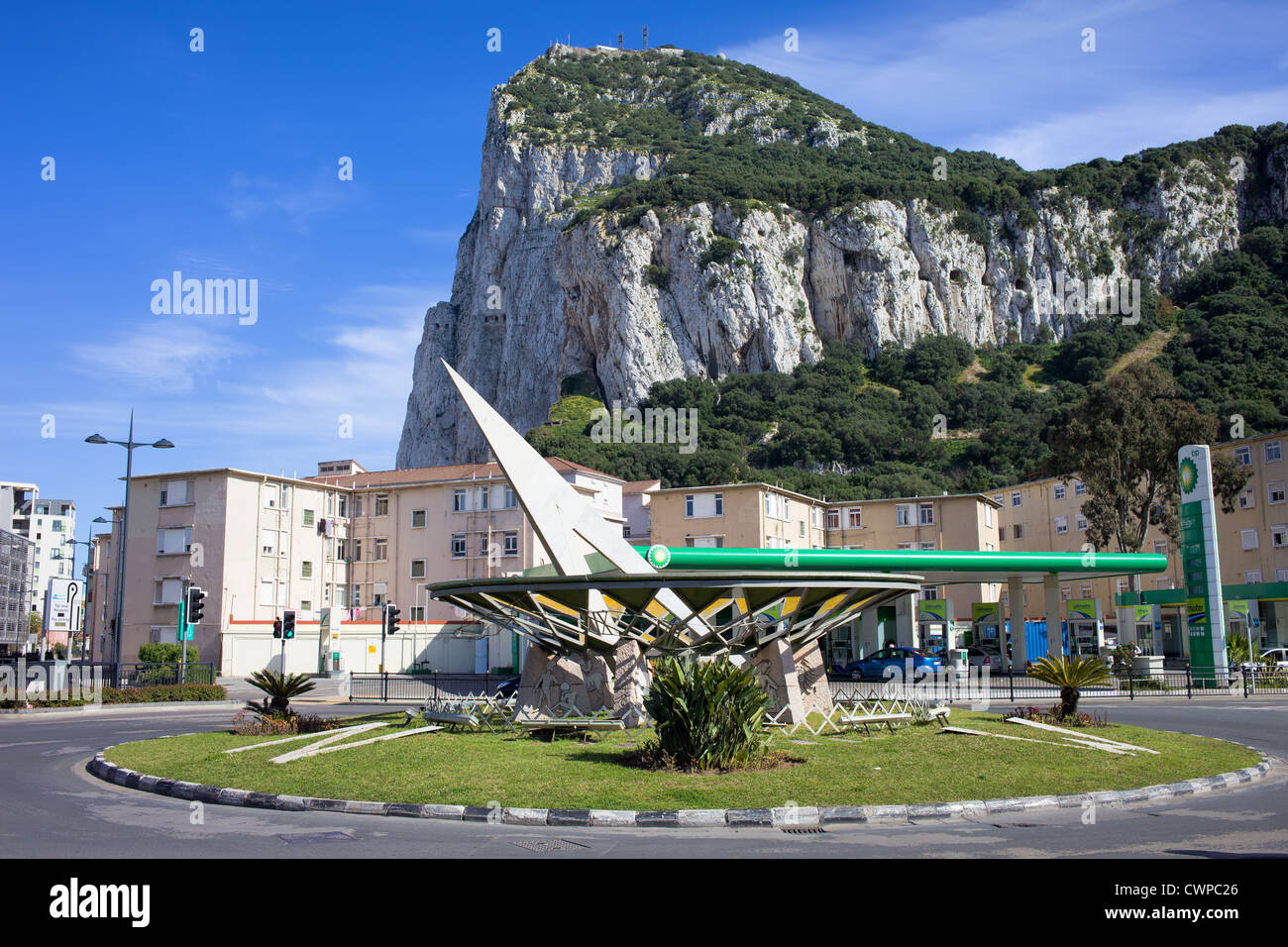 Sundial Roundaboaut at Winston Churchill Avenue at the foot of Gibraltar Rock and apartment buildings between. Stock Photo