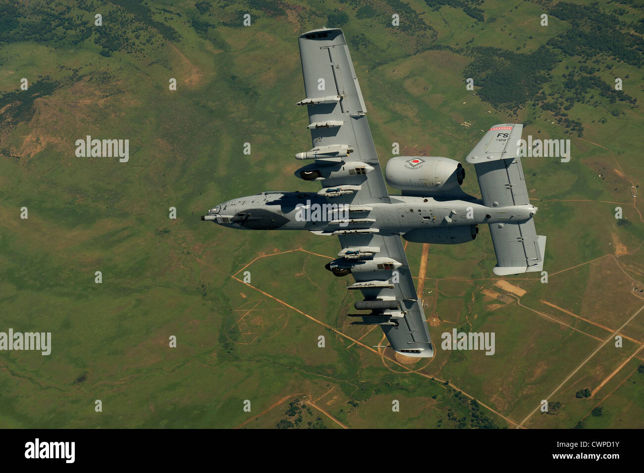 An A-10 Thunderbolt II banks into a high angle firing position during a training exercise June 4, 2012 on Razorback Range located at Fort Chaffee, Arkansas maneuver training centered forward control. Stock Photo
