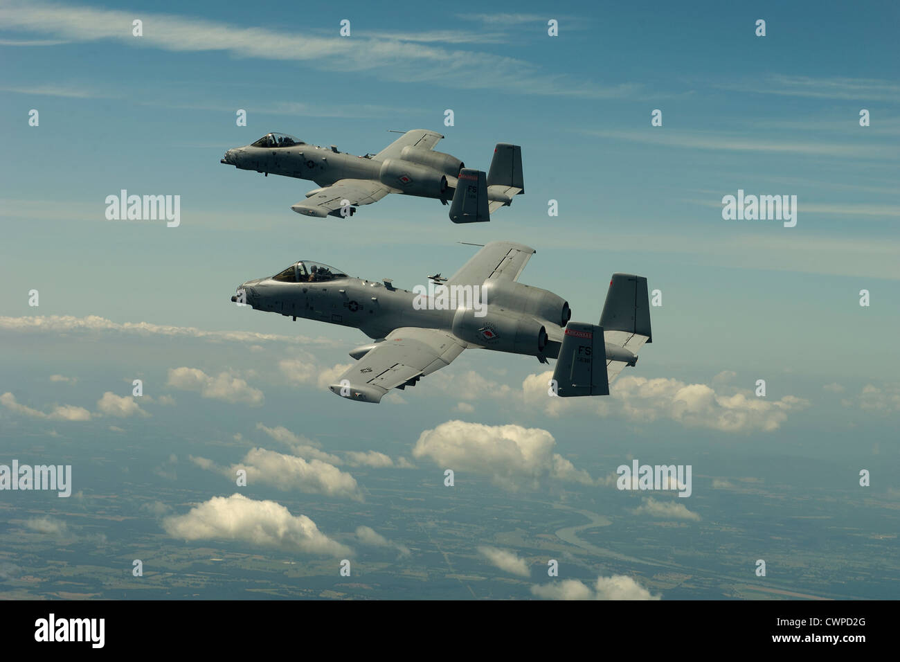 Two A-10 Thunderbolt II Warthog jets maneuver in formation June 4, 2012 over the Ouachita National Forest, AR. Stock Photo