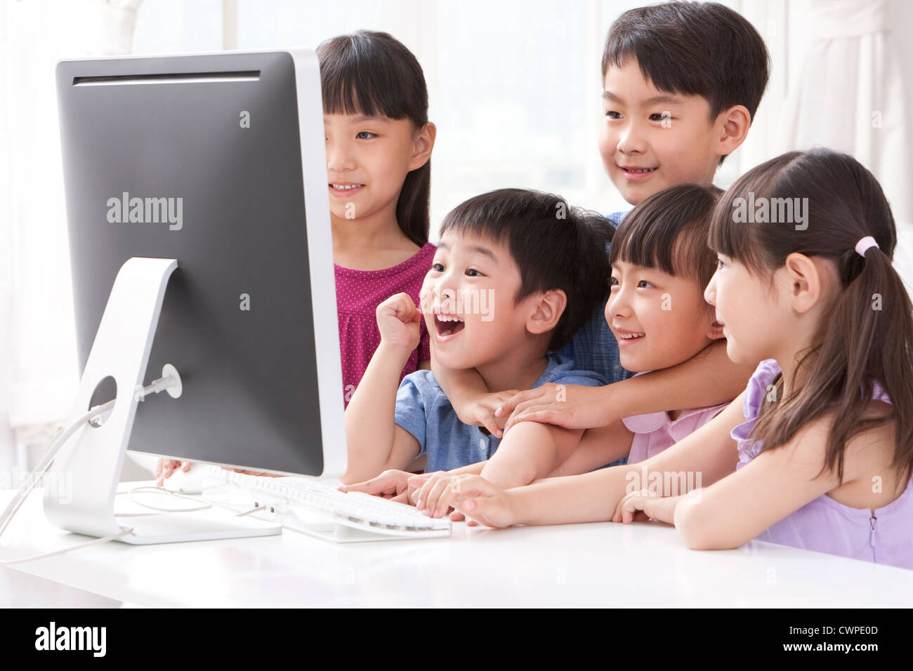 Children using computer at home Stock Photo - Alamy