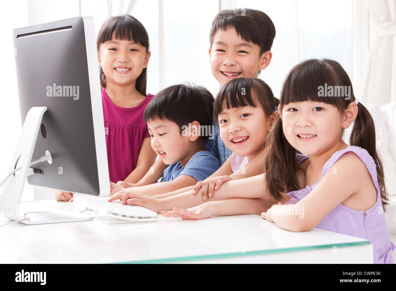 Children using computer at home Stock Photo - Alamy