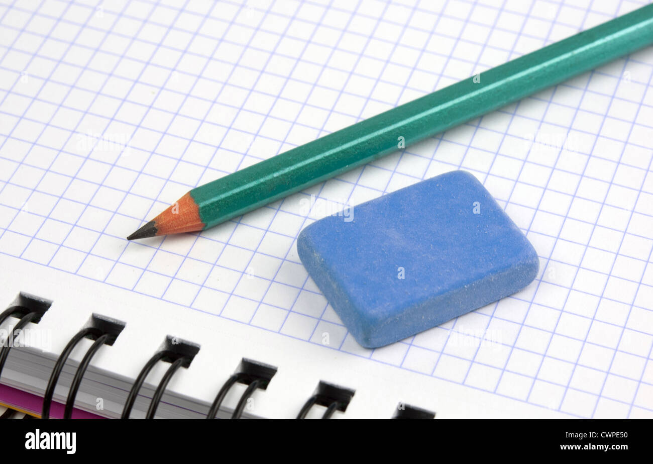 close up of notebook with pencil and eraser on top and a ruler on the side Stock Photo
