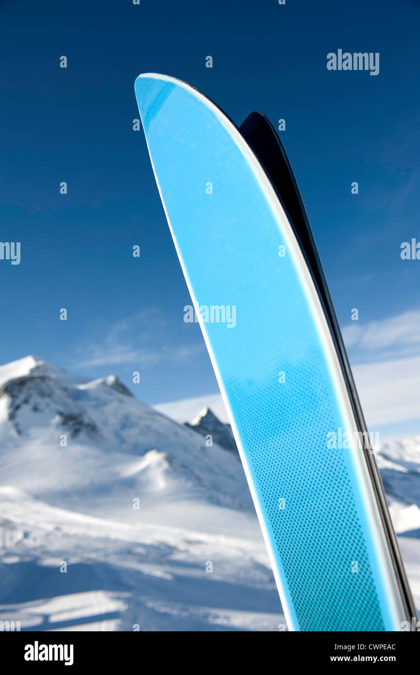 A pair of ski tips against distant mountains Stock Photo
