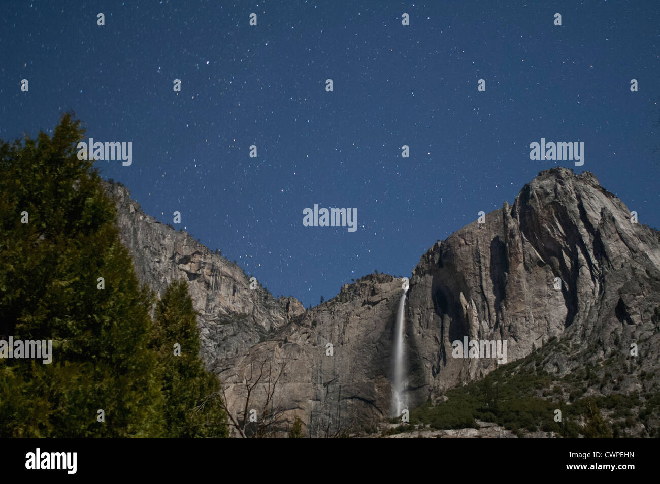 View over the Upper Yosemite Falls at night with a starry sky Stock Photo
