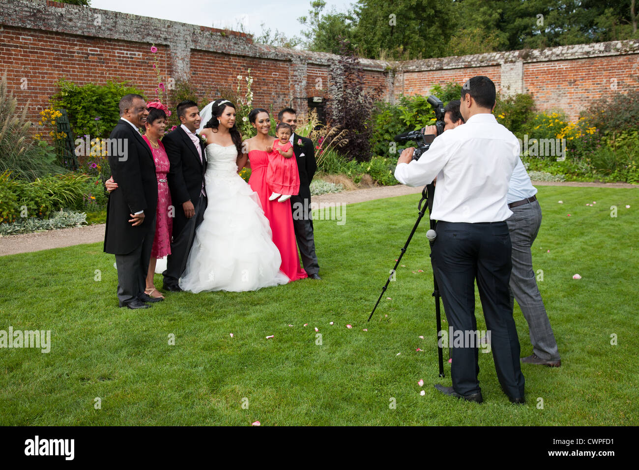 Wedding photographer taking pictures of the bride and groom with the