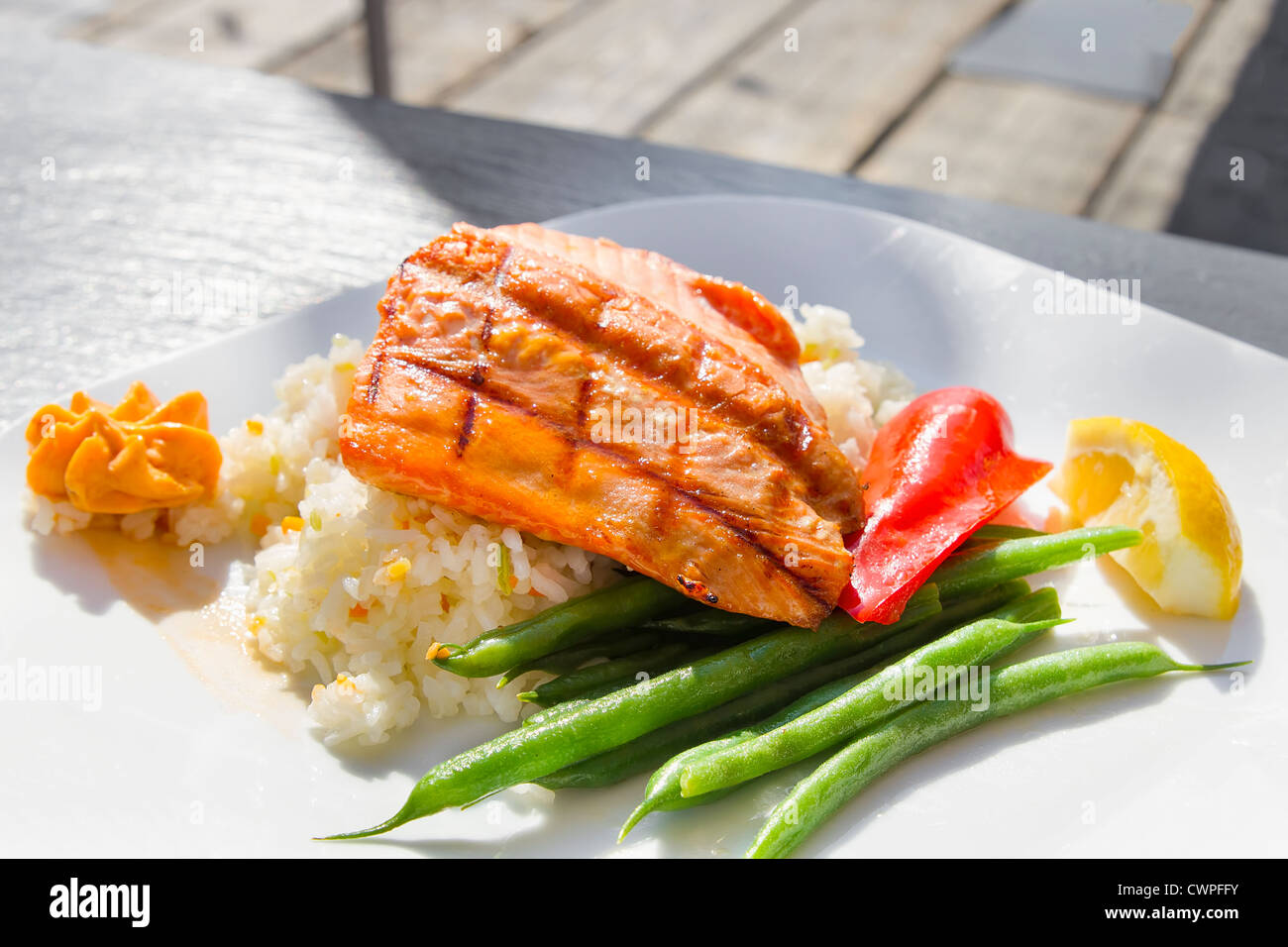 Grilled Salmon Filet Over Basmati Rice with String Beans and Bell