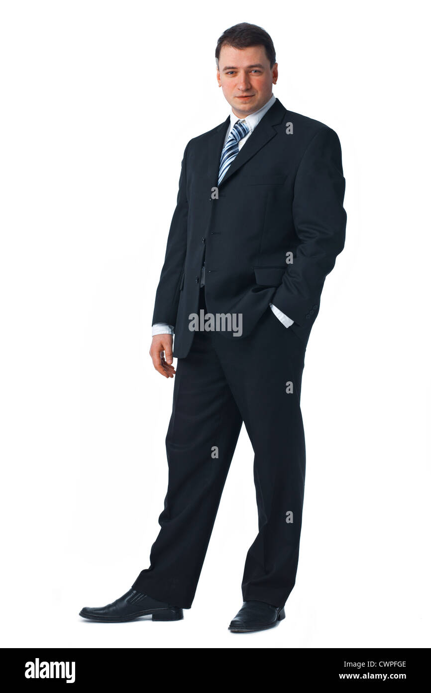 Full length of a confident young business man standing against white ...