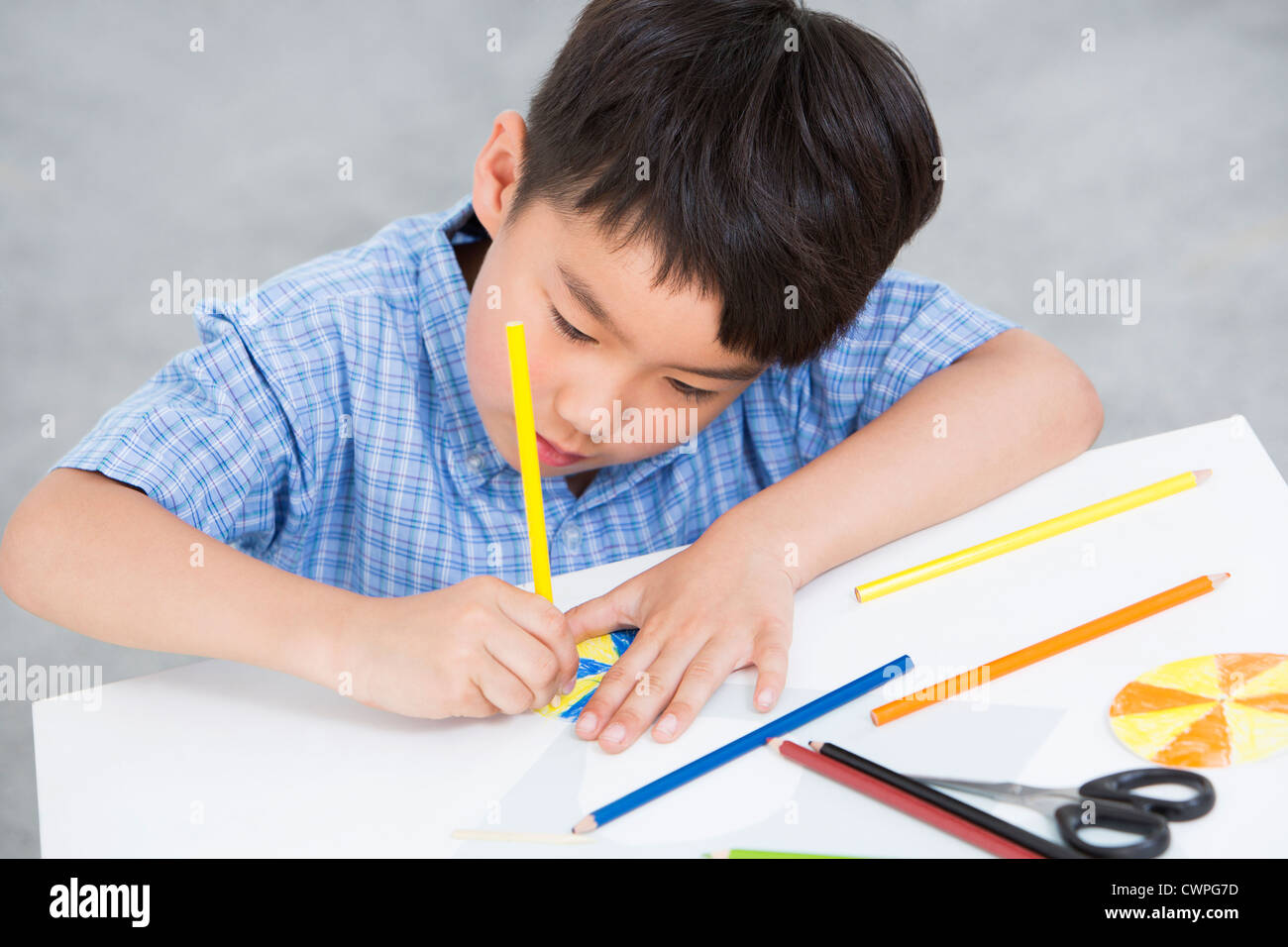 Boy Using Paper Boy making a paper toy Stock Photo - Alamy