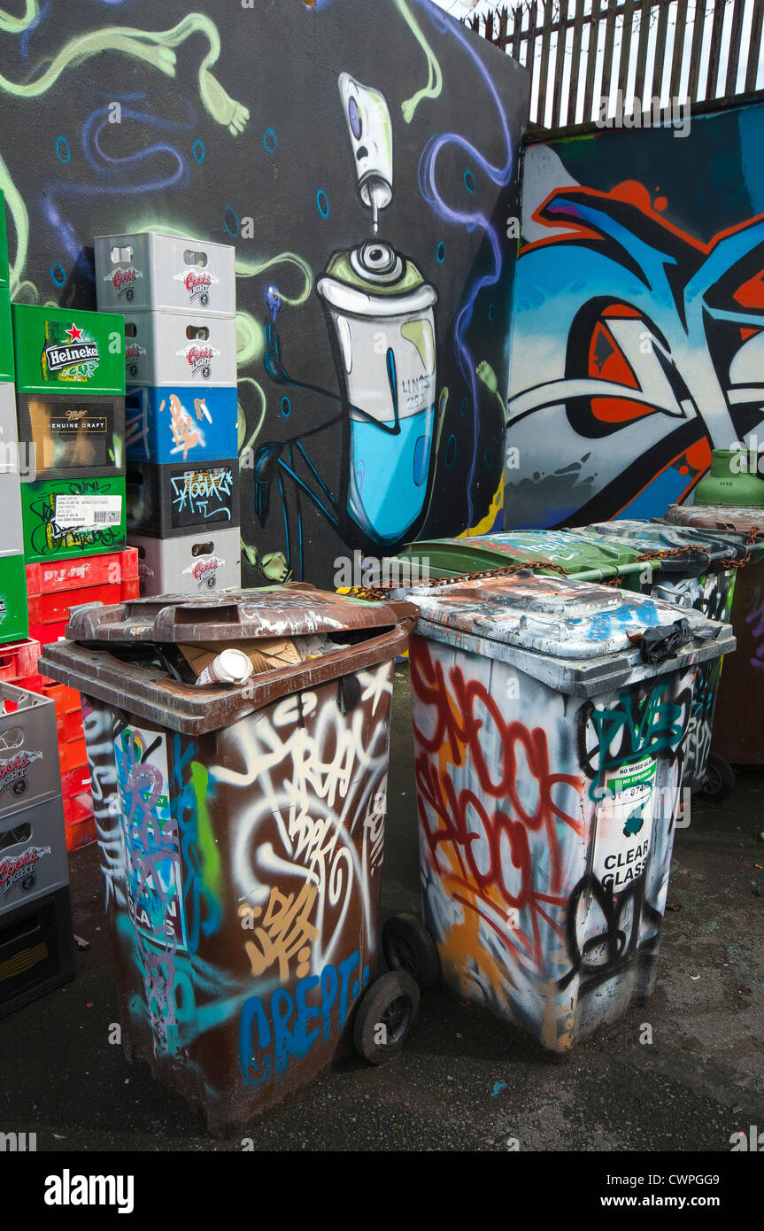 Wheelie bins covered in graffiti Stock Photo - Alamy