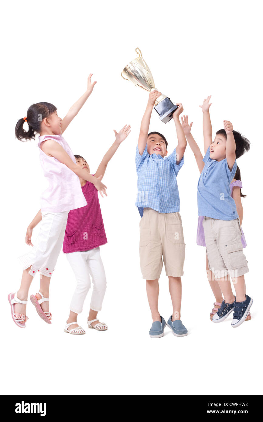 Happy children and trophy Stock Photo