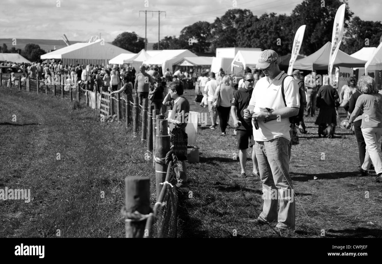 man stood outside main ring at wolsingham agricultural show, county Durham Stock Photo